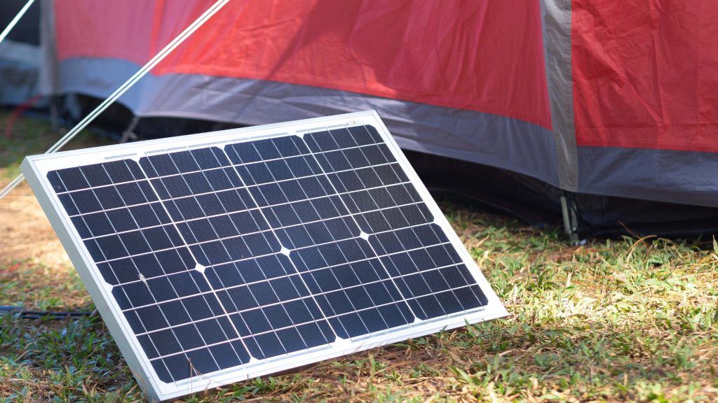 solar panel leaning on a tent string